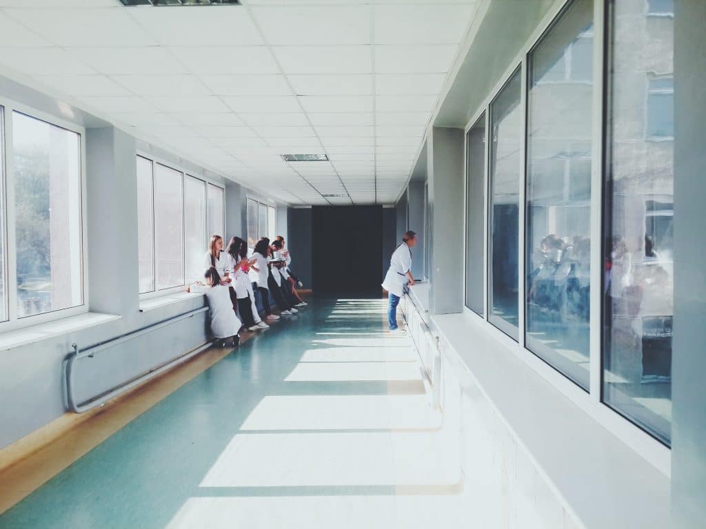 A ward of a german hospital with numerous doctors in Germany with lab coats 